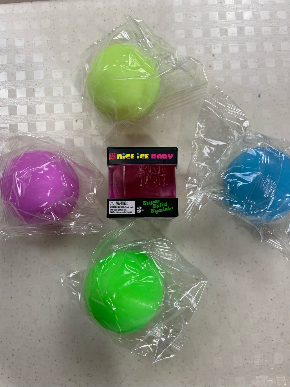 Pink Nee Doh Nice Ice Baby plus four individually sealed mini squishies